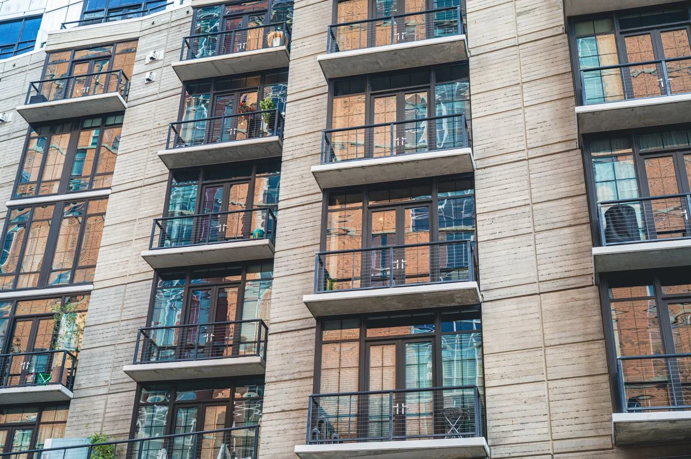 Residential apartment balconies and windows; representative stock photograph