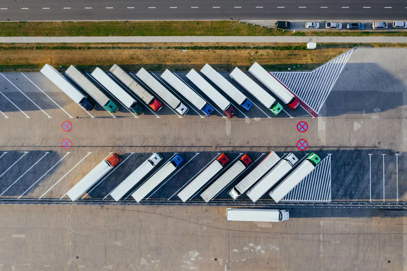 Aerial view of freight trailers parked at a logistics yard; representative stock photograph